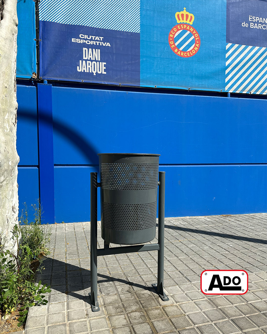 Circular iron urban litter bin installed