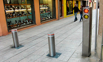 Retractable stainless steel bollards installed with automation