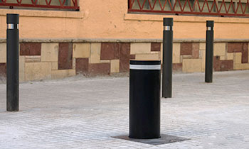 Retractable lacquered iron bollards installed