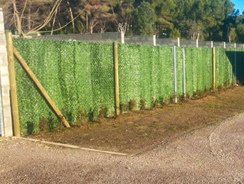 wooden fences with Artificial hedge installed