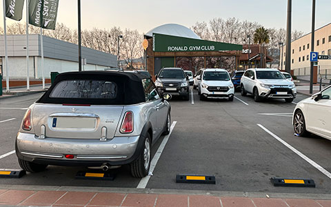 Silver plastic wheel stop for vehicles installed